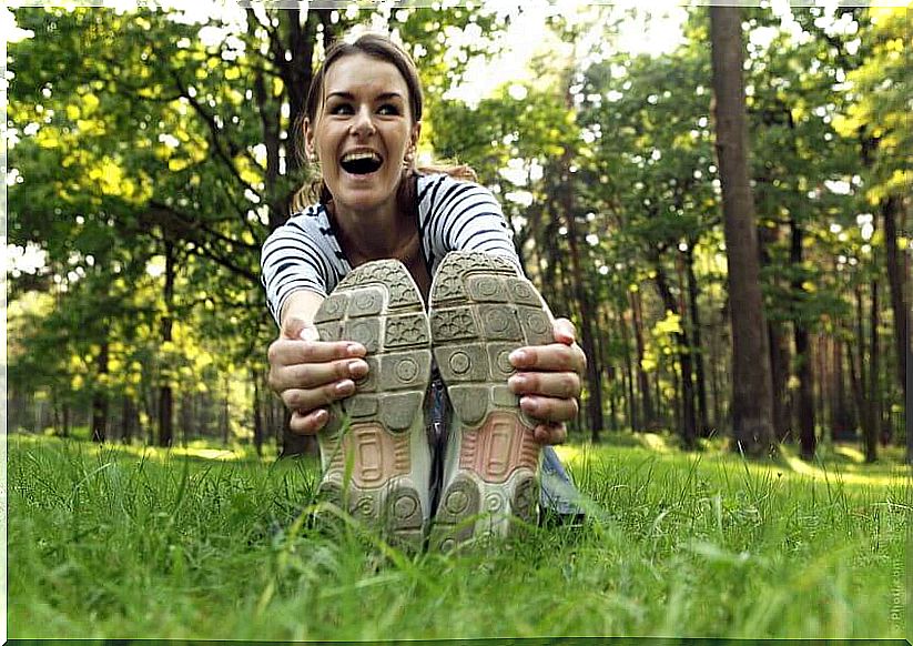 woman stretching on the grass