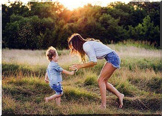 son and mother playing